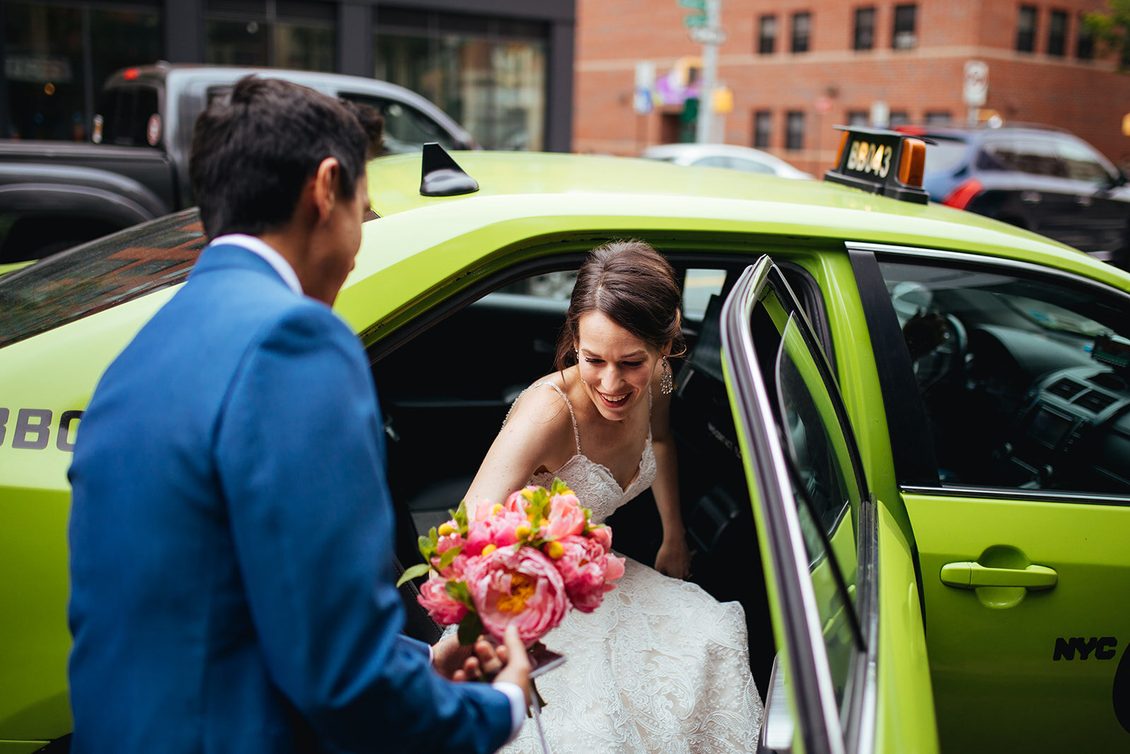 Future spouses getting out of a cab in Brooklyn NYC Shawnee Custalow wedding photography