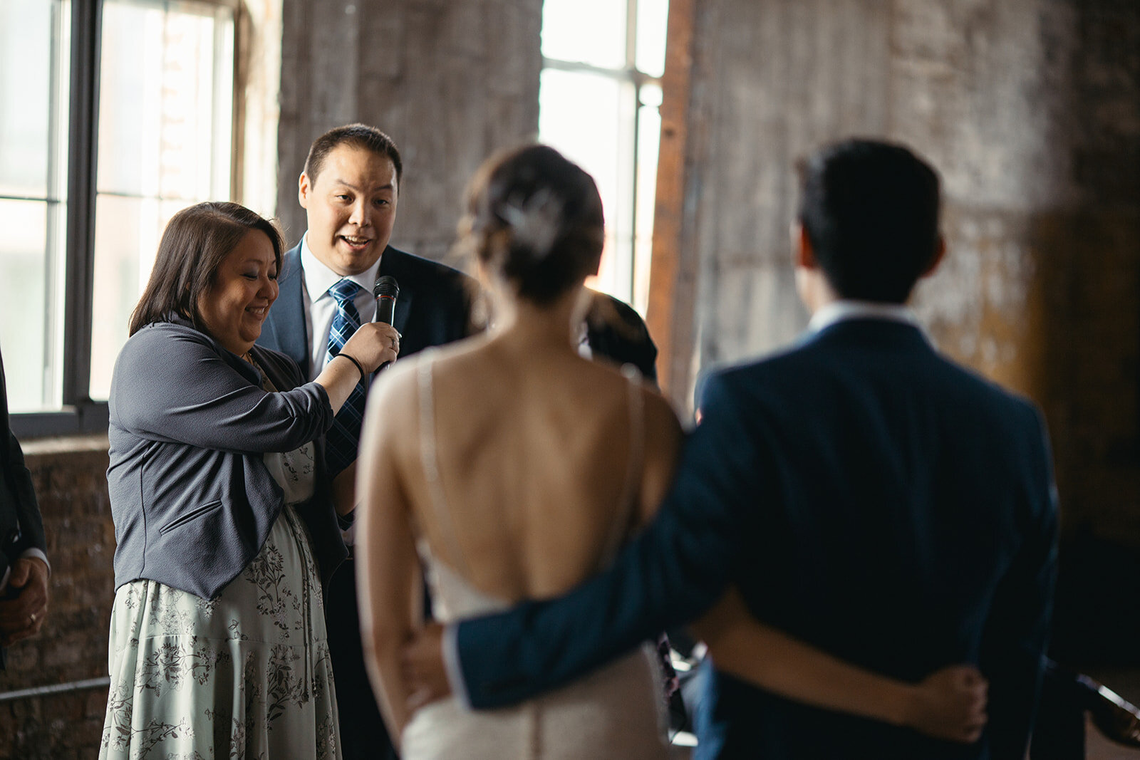 Guests speaking at The Greenpoint Loft wedding Brooklyn NY Shawnee Custalow photography