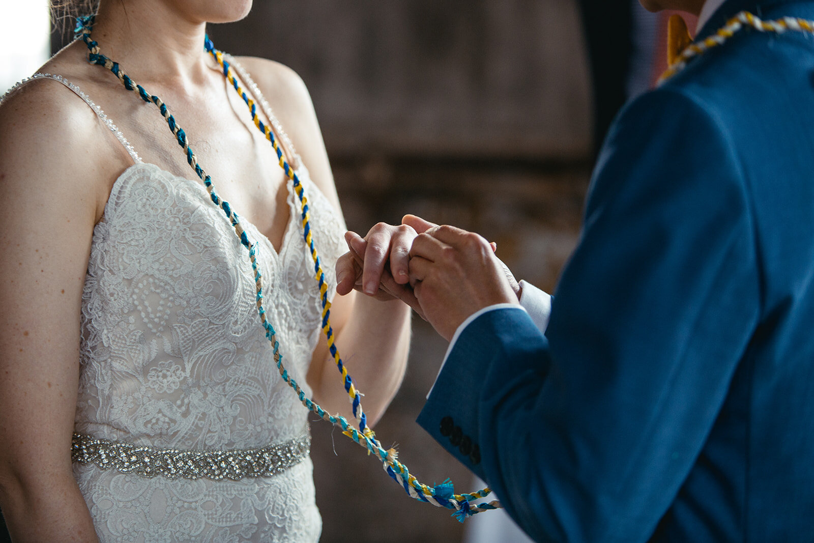 Bride and groom exchanging rings at Greenpoint Loft wedding NY Shawnee Custalow photography