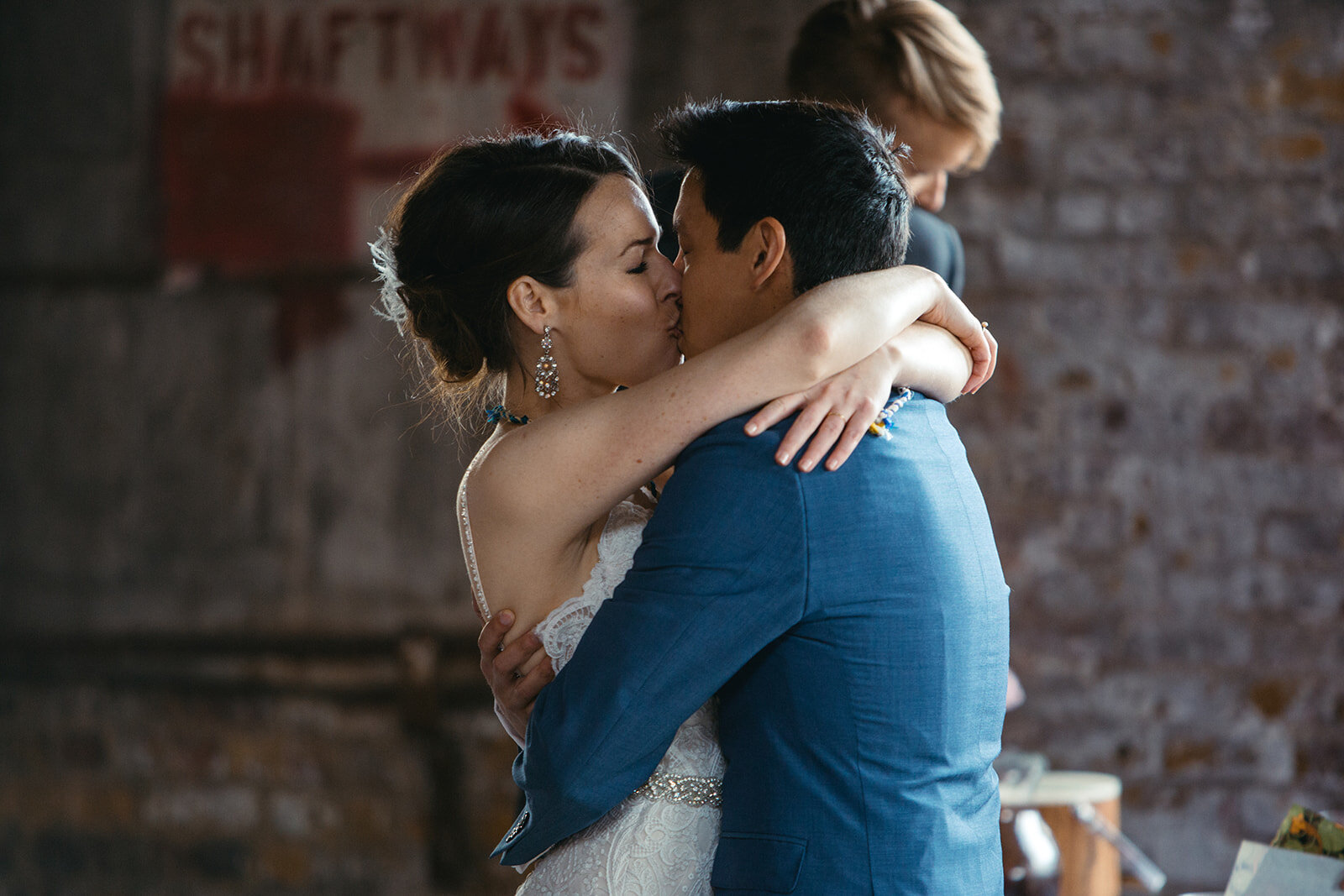 Future spouses kissing at Greenpoint Loft wedding Brooklyn NY Shawnee Custalow photography