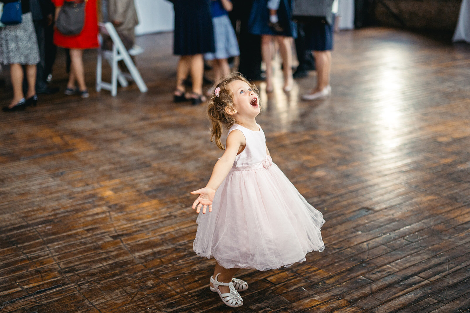 A little girl in pink dancing at the Greenpoint Loft Brooklyn NYC Shawnee Custalow photography