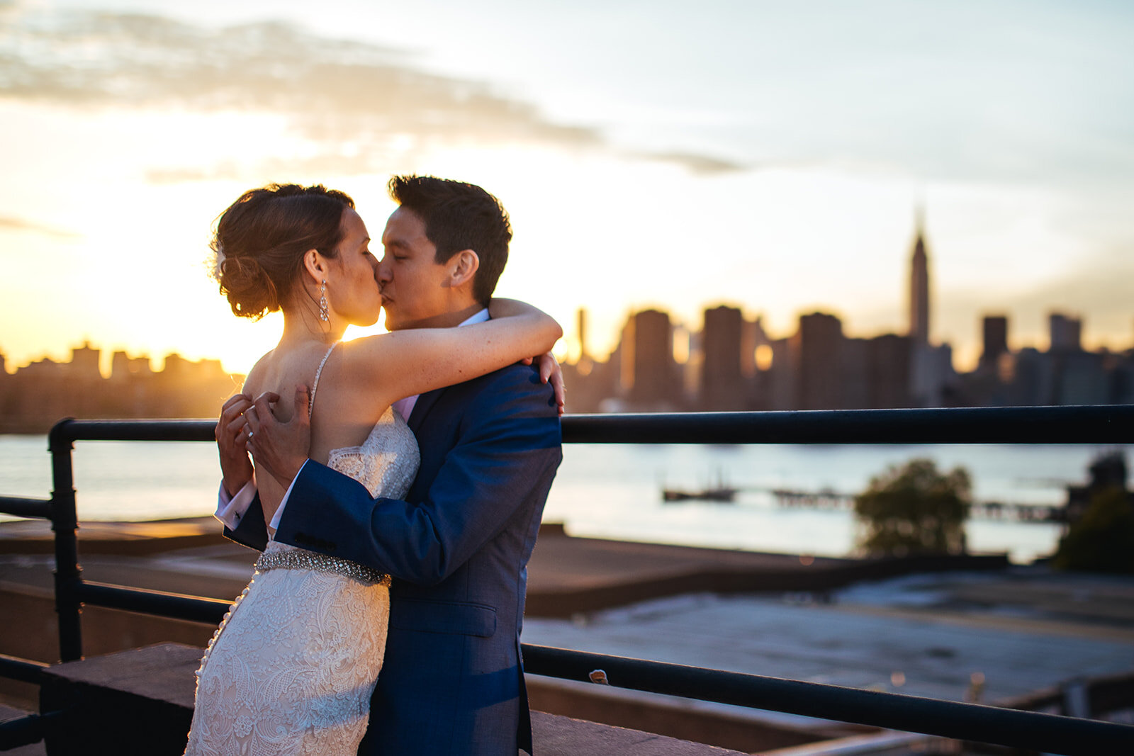 Newlyweds kissing at sunset before the NYC skyline Brooklyn Shawnee Custalow photography