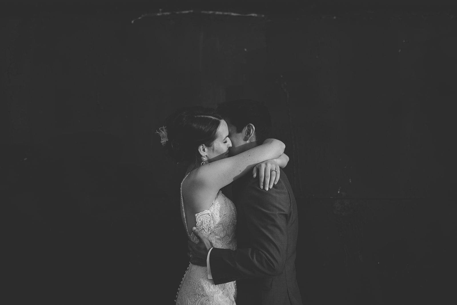 Newlyweds embracing at the Greenpoint Loft Brooklyn NYC Shawnee Custalow photography