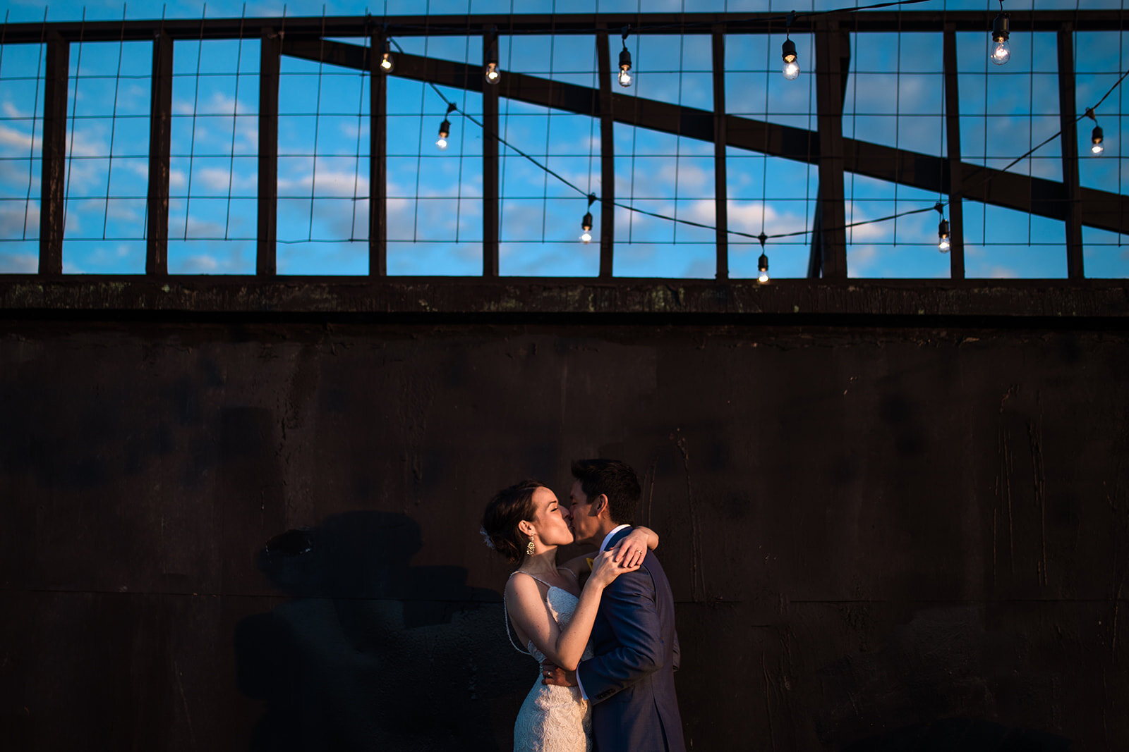 Newlyweds kissing at the Greenpoint Loft Brooklyn NYC Shawnee Custalow photography