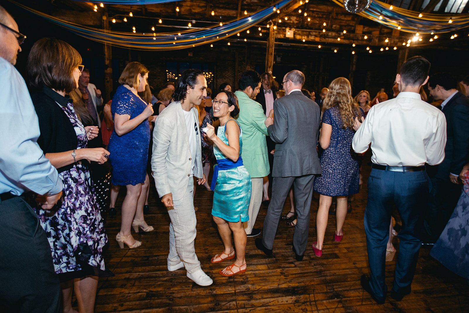 Wedding guests dancing at the Greenpoint Loft Brooklyn NYC Shawnee Custalow photography