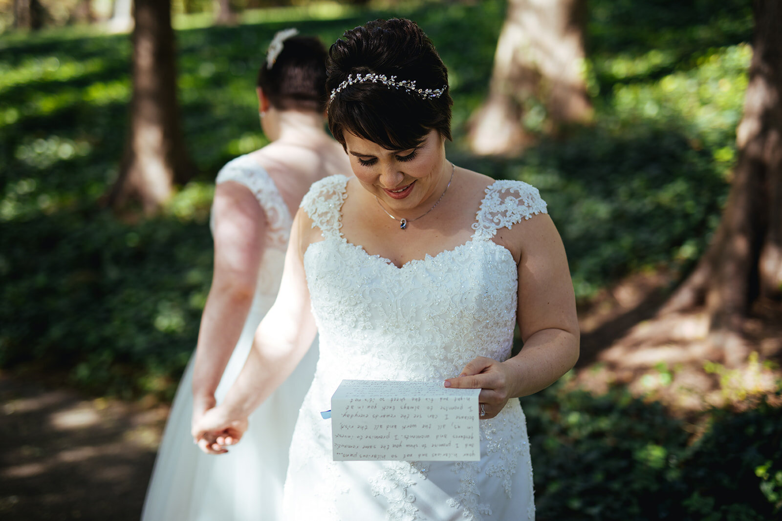 LGBTQ spouses reading letters near DC Shawnee Custalow wedding photographer
