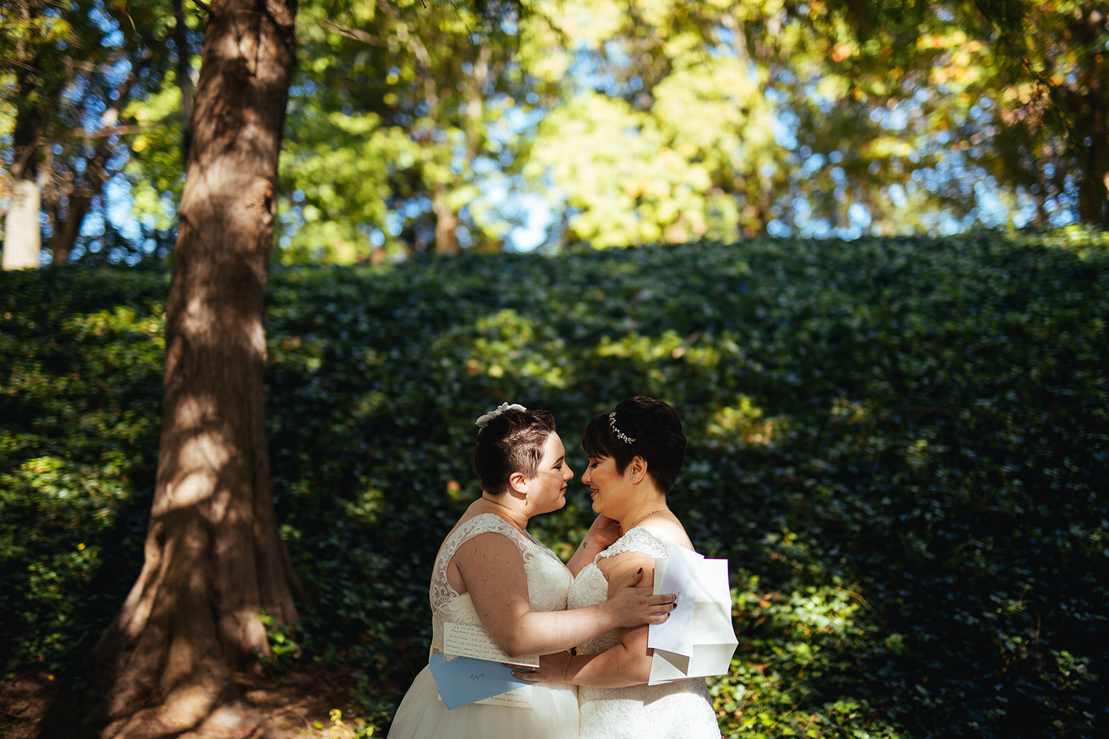 LGBTQ brides lean in to kiss in Gaithersburg Shawnee Custalow wedding photography