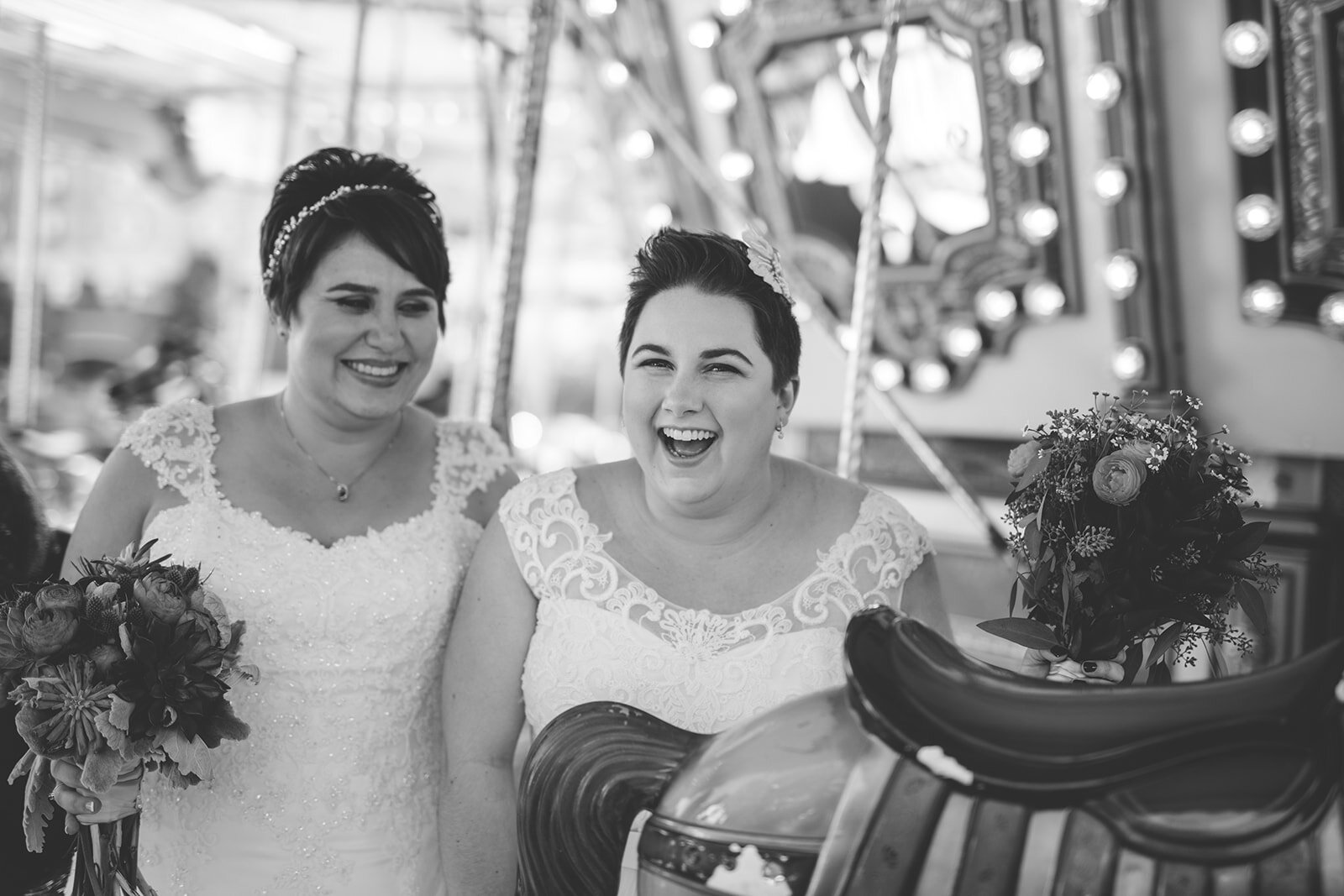 Queer spouses on a carousel in Gaithersburg MD Shawnee Custalow wedding photography