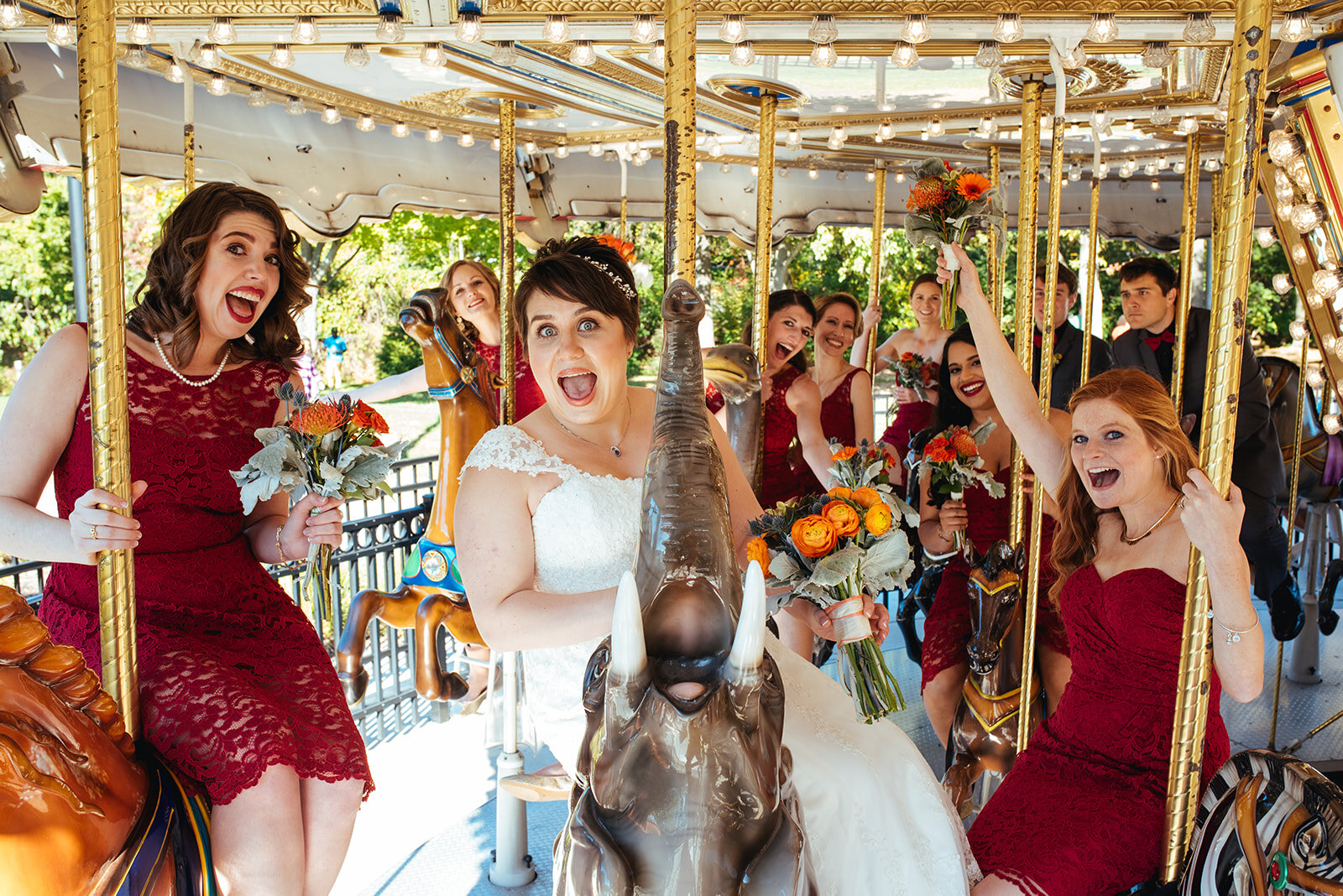 Bride and bridesmaids on a carousel near DC Shawnee Custalow wedding photography
