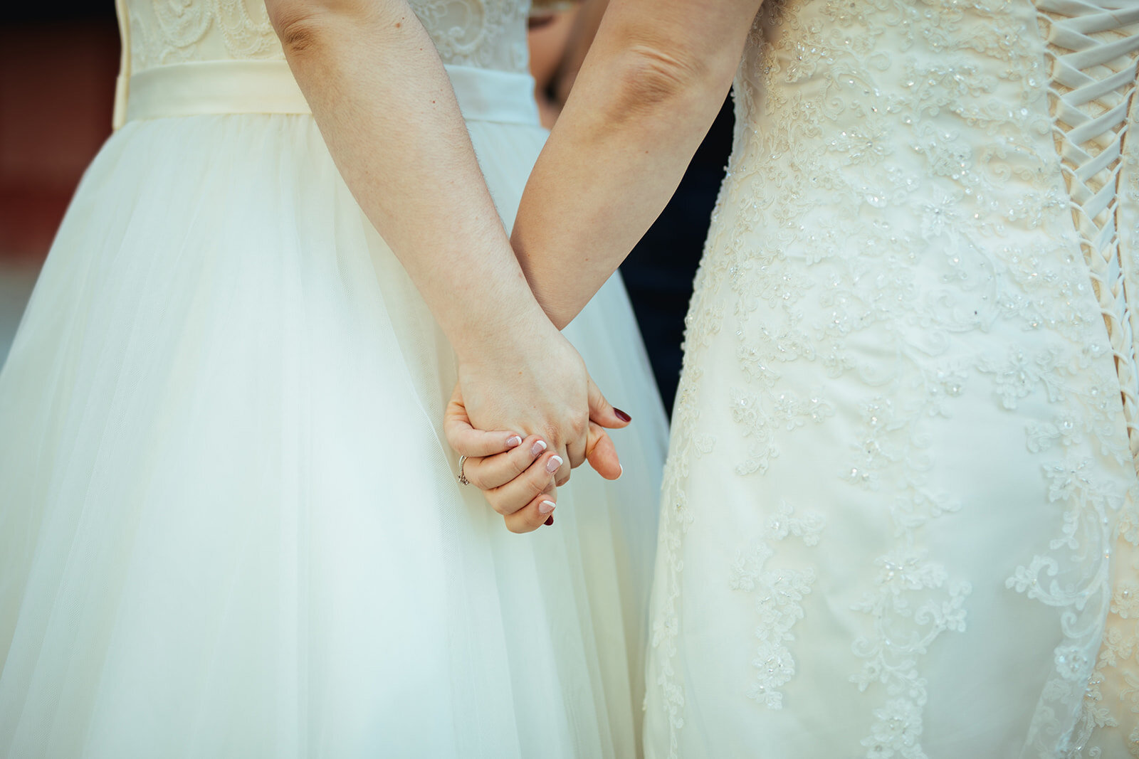 Queer newlyweds holding hands in Gaithersburg MD Shawnee Custalow wedding photography