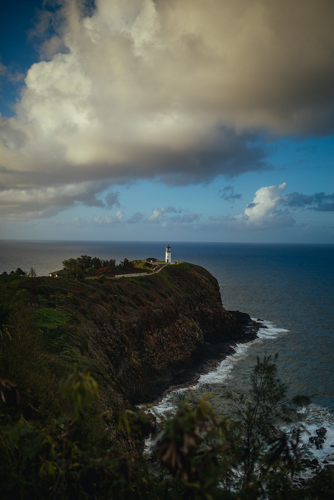 Lighthouse over a cliffside on Kauai Hawaii Shawnee Custalow wedding photographer