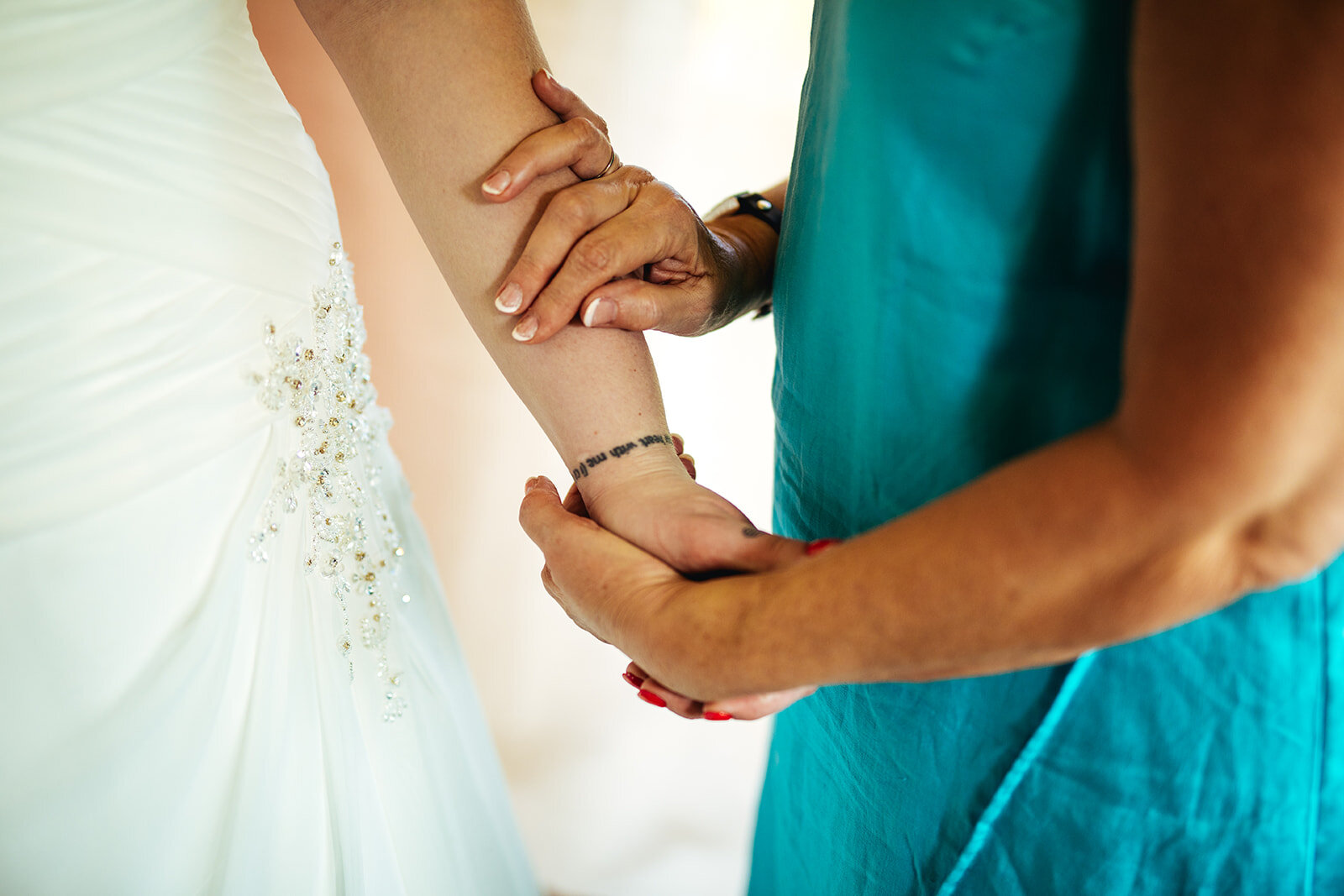 Bride holding hands with a guest in Kauai HI Shawnee Custalow wedding photography