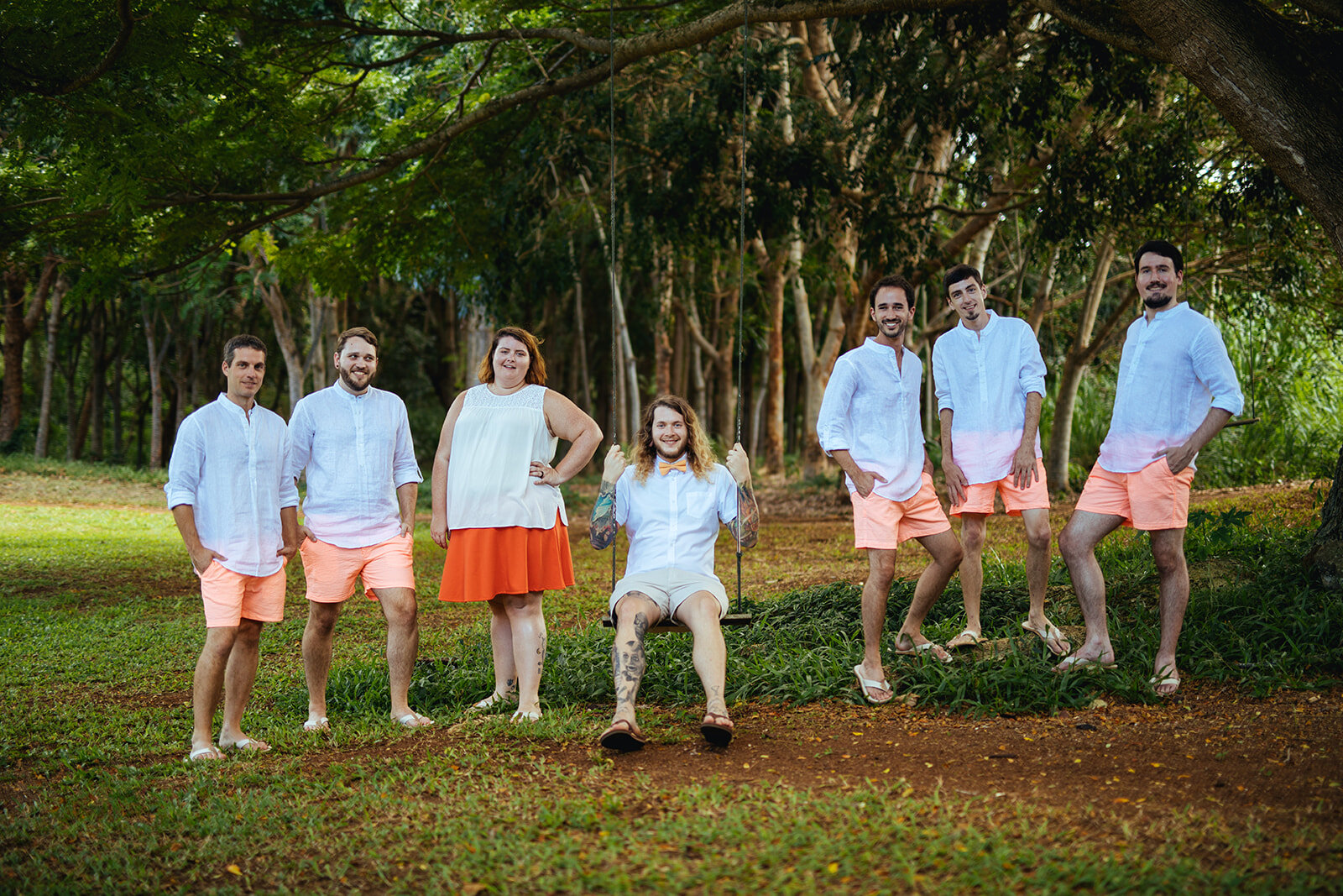 Groom on a swing with honor attendants in Kauai Hawaii Shawnee Custalow photography