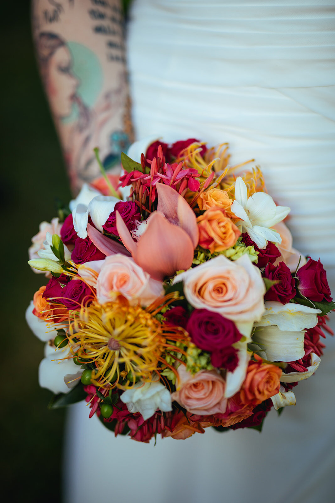 Bride holding a lush bouquet in Kauai Hawaii Shawnee Custalow wedding photographer