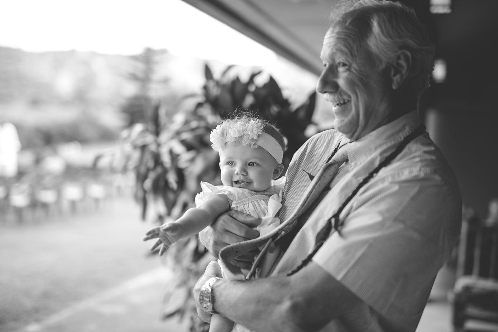 Wedding guest with an infant in Kauai Hawaii Shawnee Custalow photography