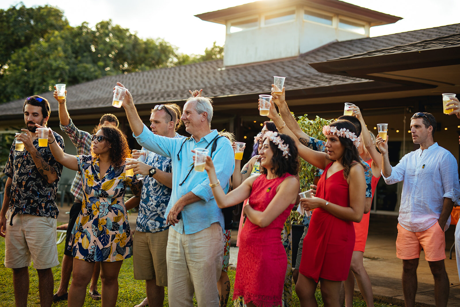 Wedding guests raising a toast in Kauai Hawaii Shawnee Custalow photography
