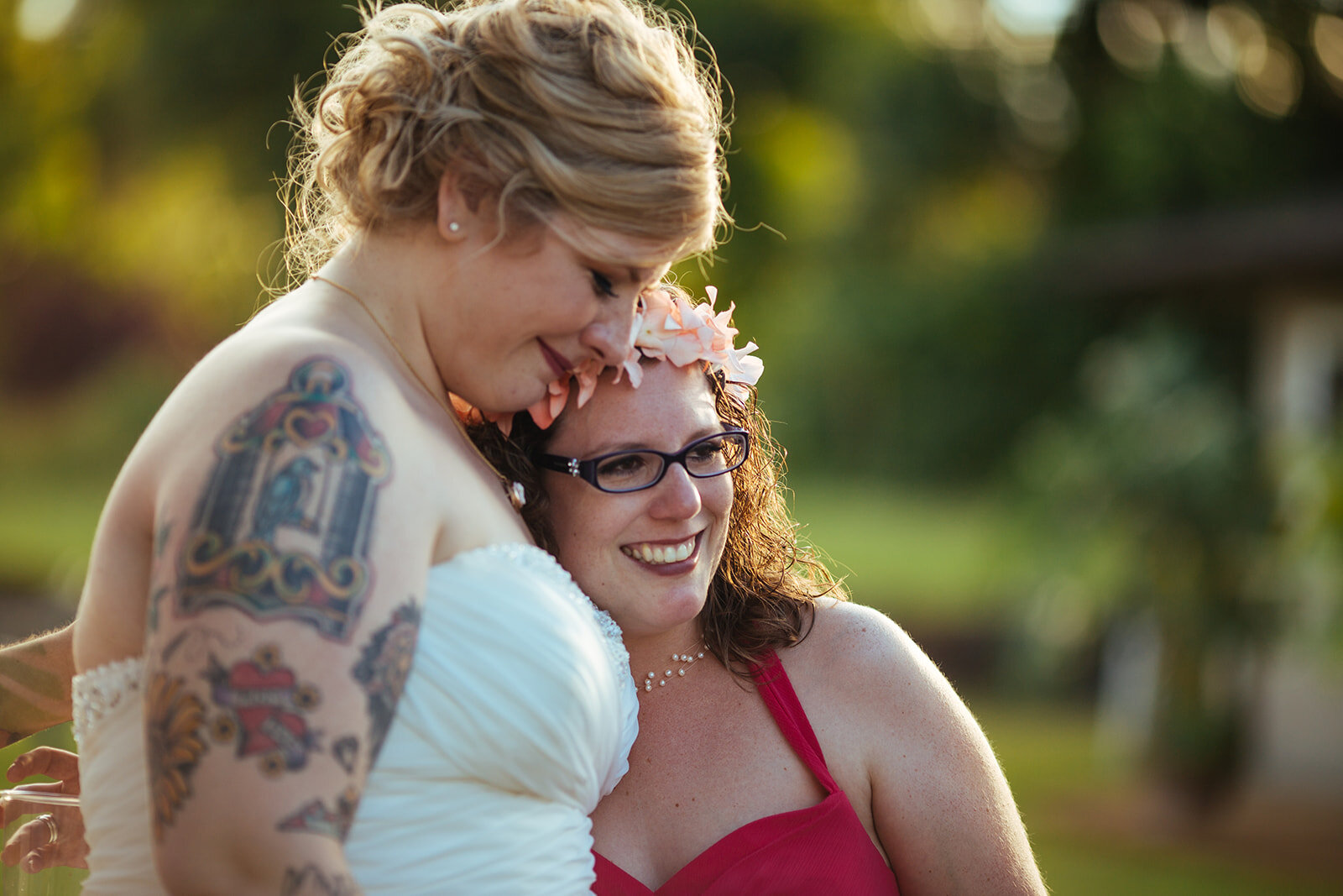 Bride embracing a guest in Kauai Hawaii Shawnee Custalow wedding photography