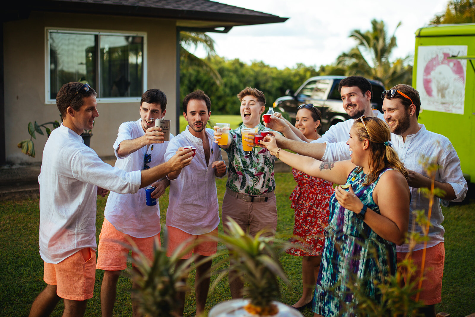 Wedding guests raising a toast in Kauai Hawaii Shawnee Custalow photography