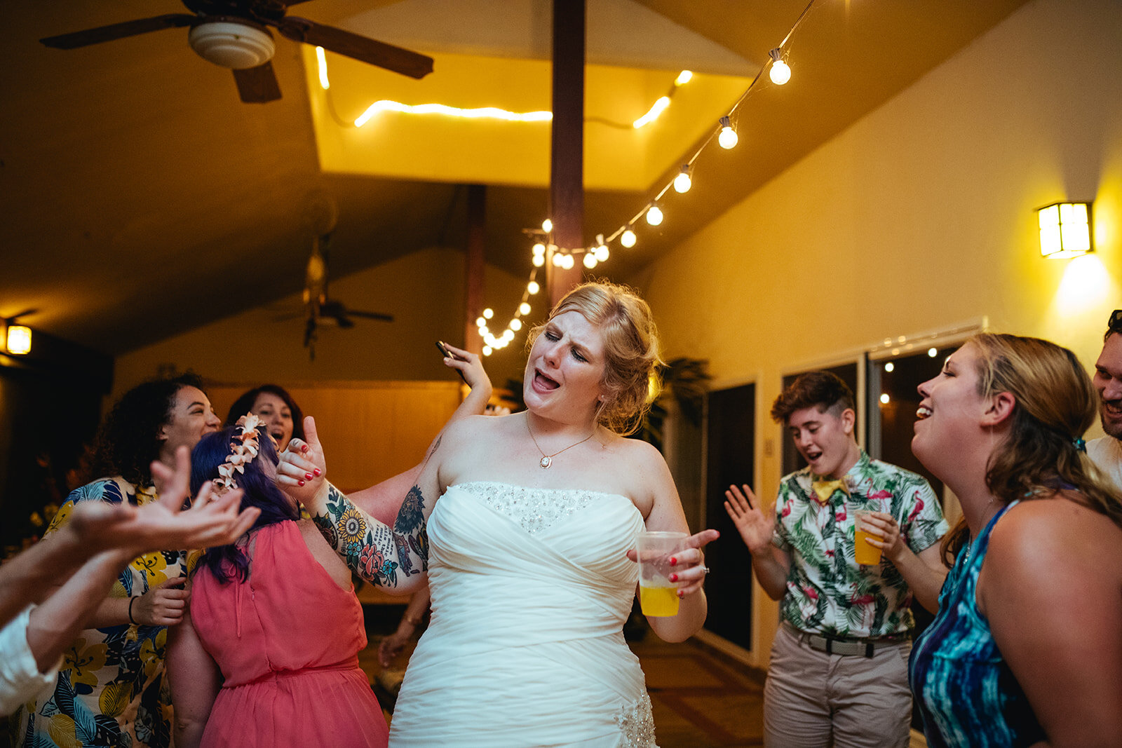 Newlywed and guests dancing in Kauai Hawaii Shawnee Custalow wedding photographer