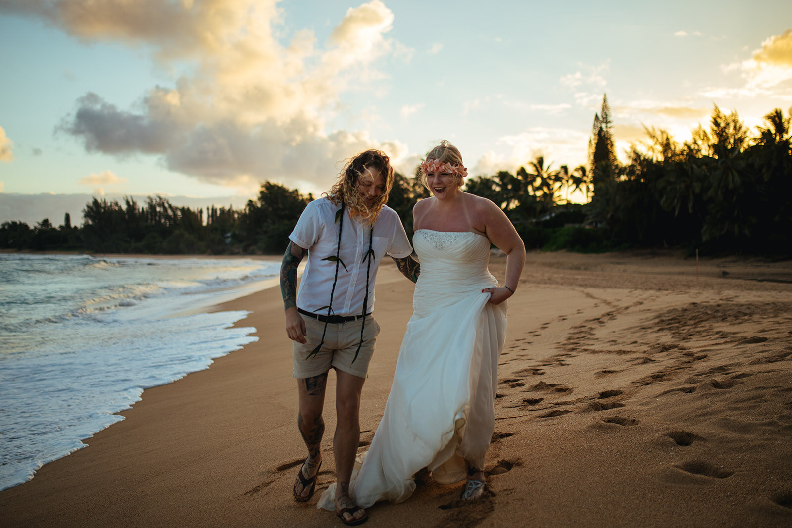 Newlyweds on the beach in Kauai Hawaii Shawnee Custalow wedding photography