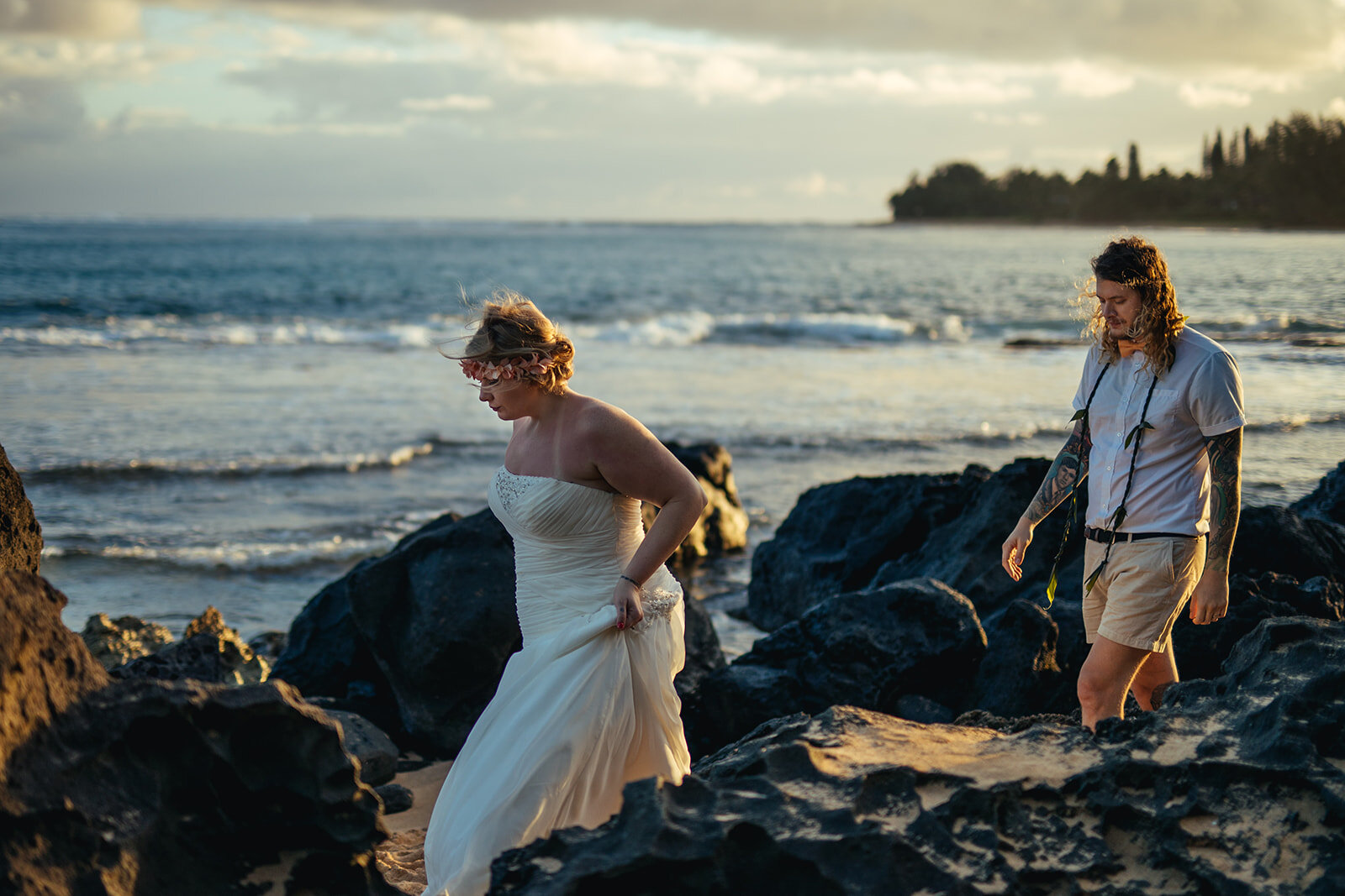 Newlyweds walking along the beach in Kauai Hawaii Shawnee Custalow wedding photography