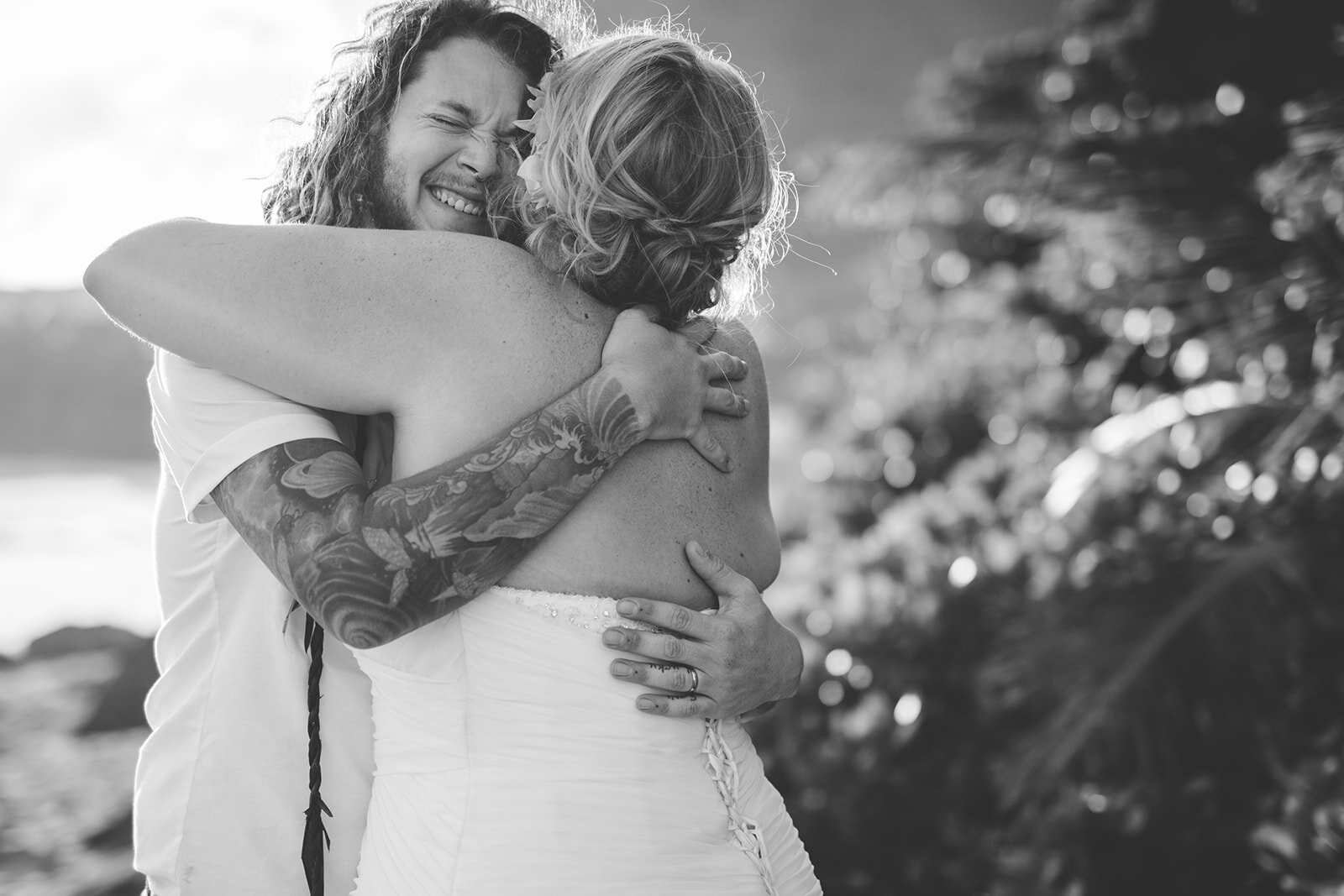 Newlyweds hugging each other in Kauai Hawaii Shawnee Custalow wedding photography