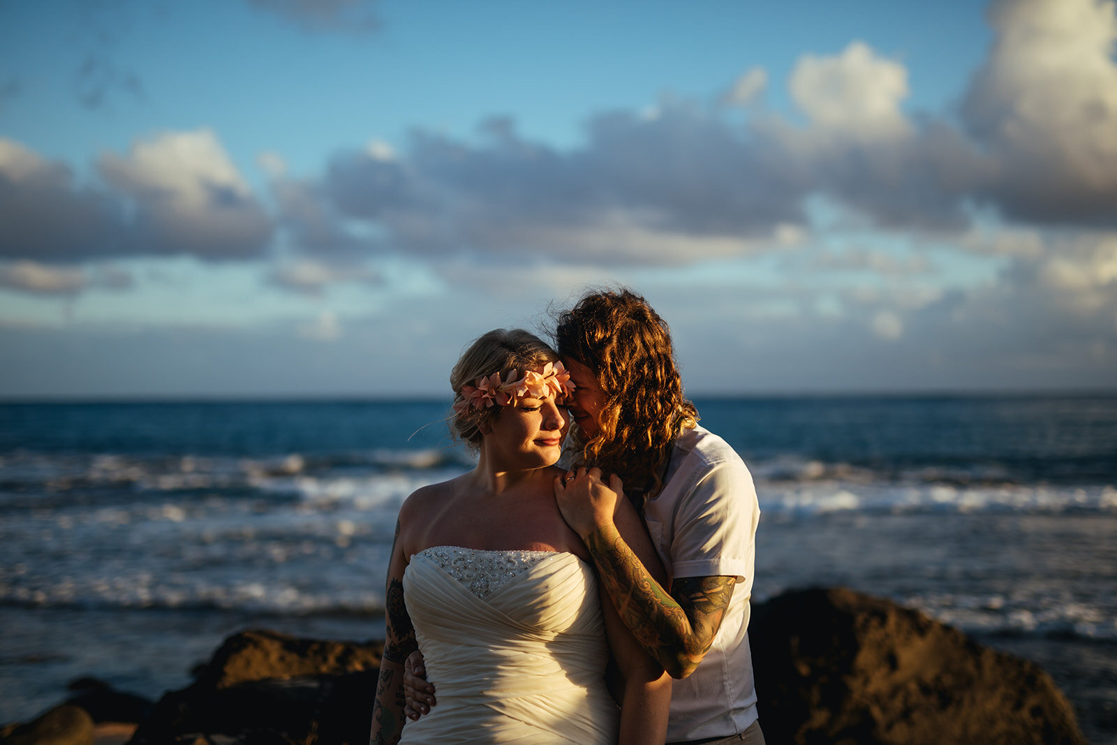 Newlyweds embracing by the sea in Kauai Hawaii Shawnee Custalow wedding photography