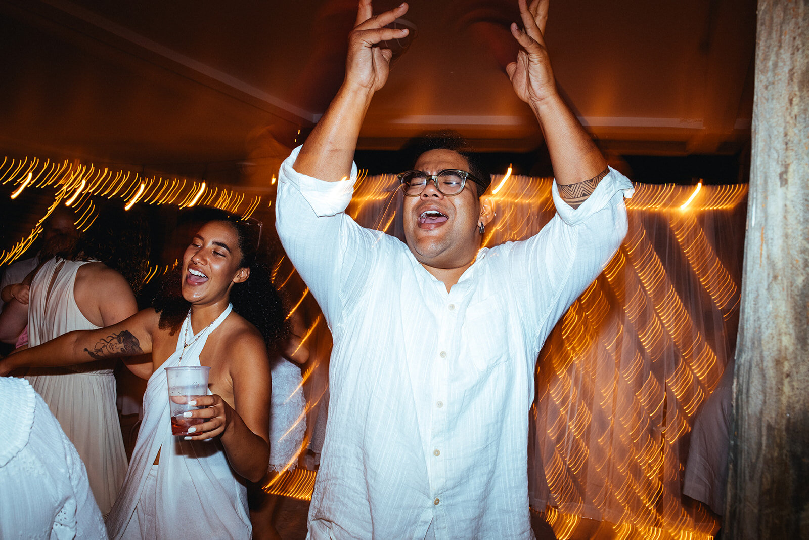 Wedding guests dancing at Folly Beach SC Shawnee Custalow photography