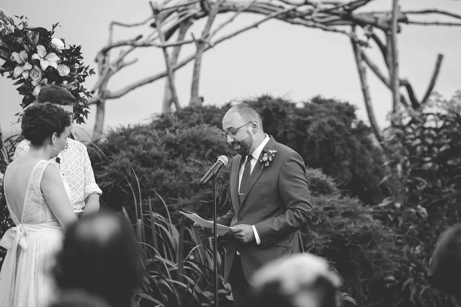Groom reading vows to bride on Tilghman Island MD Shawnee Custalow photography