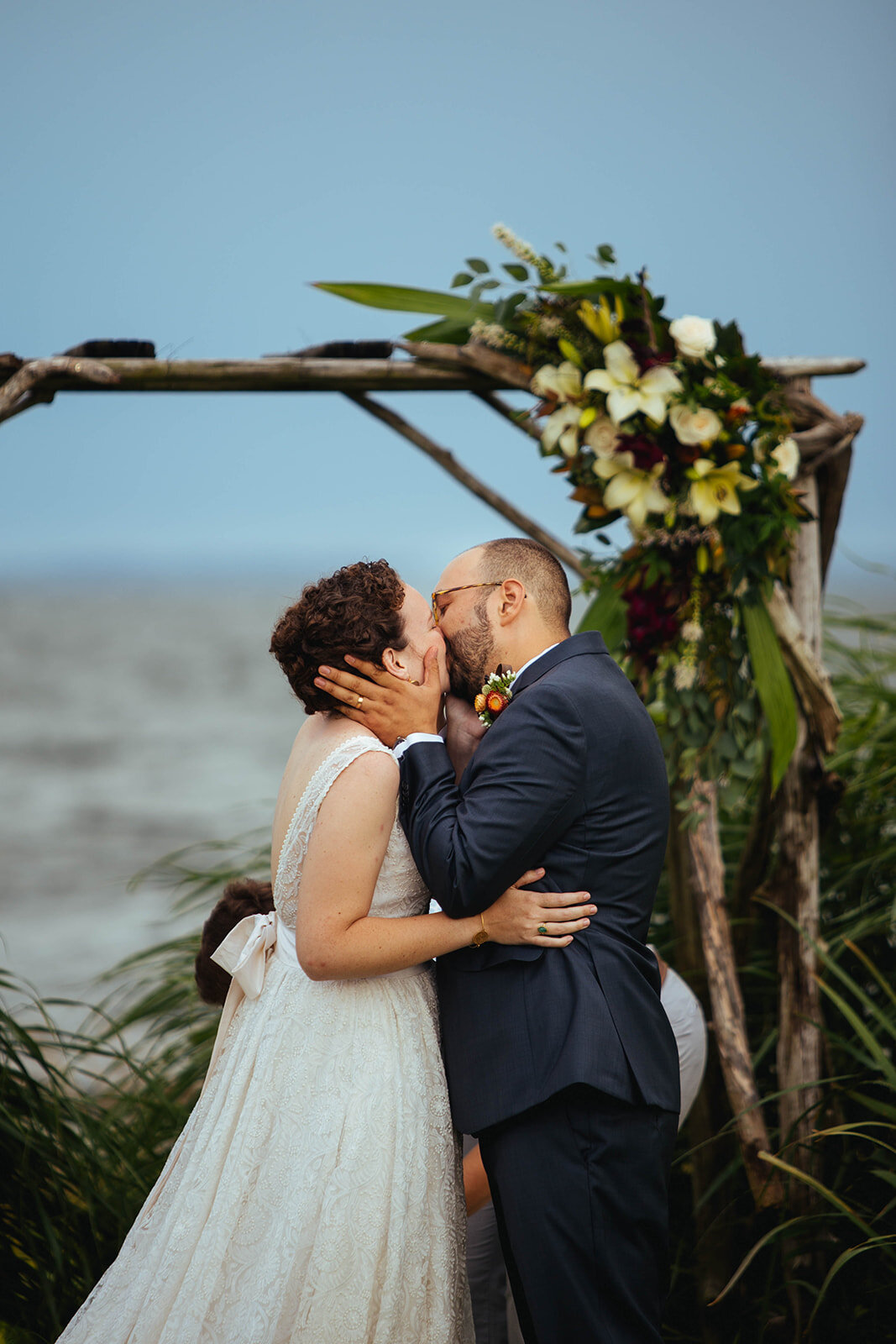 Newlyweds kissing on Tilghman Island MD Shawnee Custalow photography