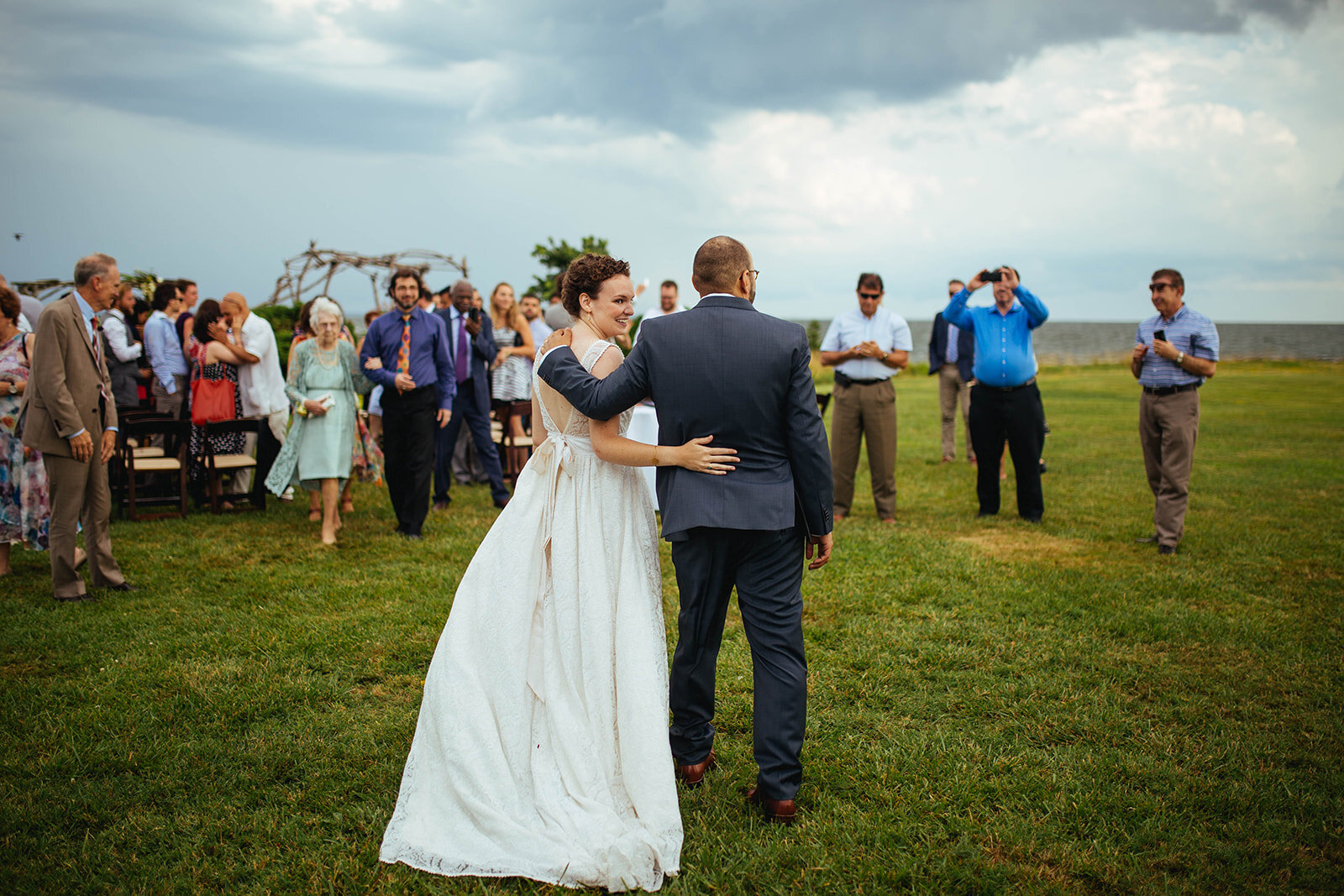 Newlyweds surrounded by guests on Tilghman Island MD Shawnee Custalow photography