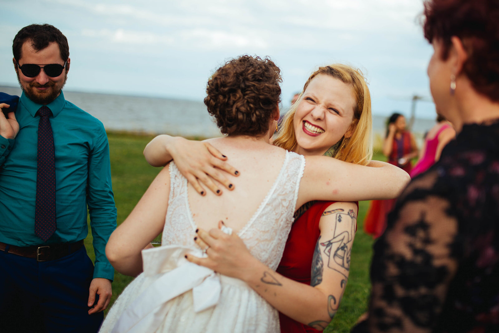 Newlywed hugging a guests on Tilghman Island MD Shawnee Custalow photography