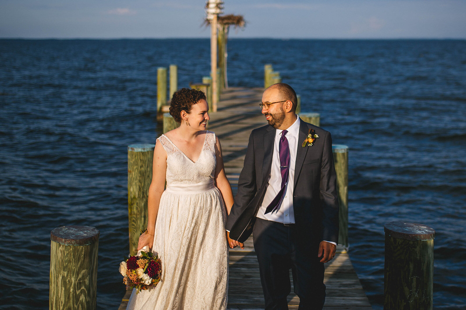 Newlyweds on a pier off Tilghman Island MD Shawnee Custalow wedding photography