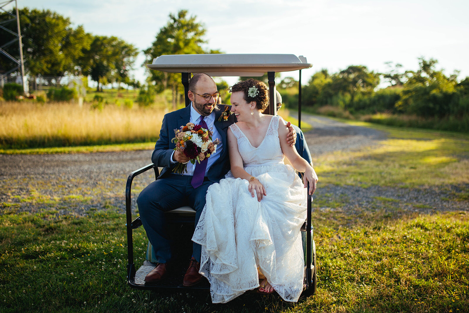 Newlyweds on a golf cart on Tilghman Island MD Shawnee Custalow wedding photography