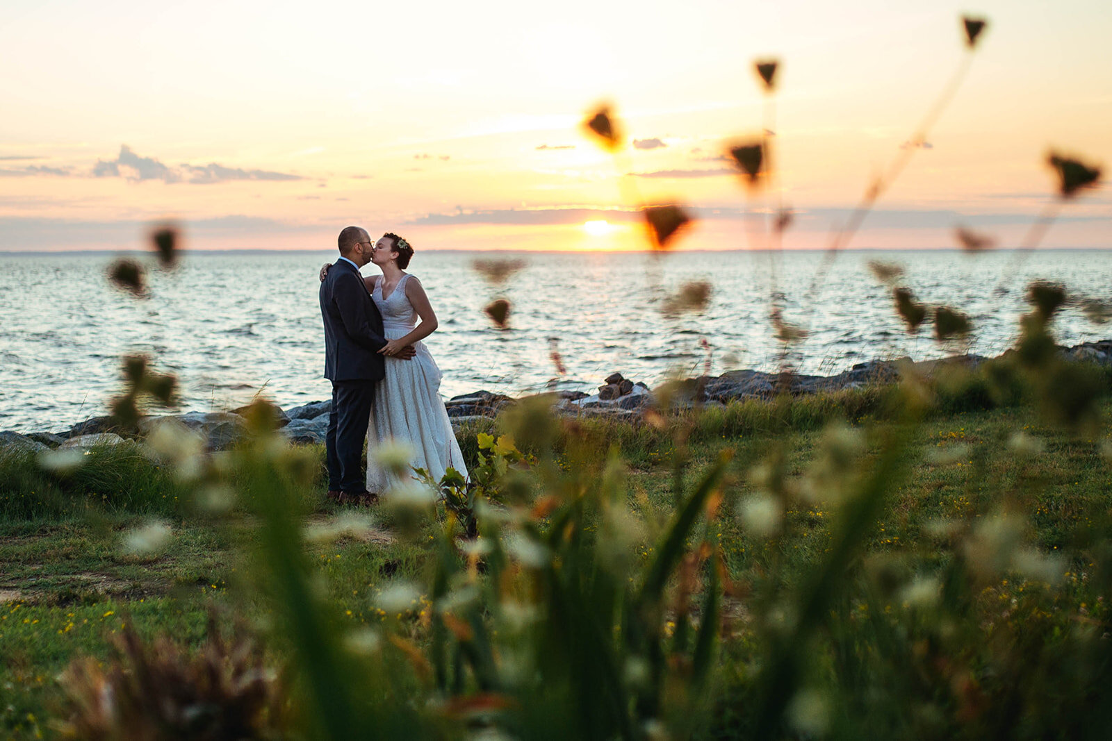 Newly married couple kissing at sunset on Tilghman Island MD Shawnee Custalow photography