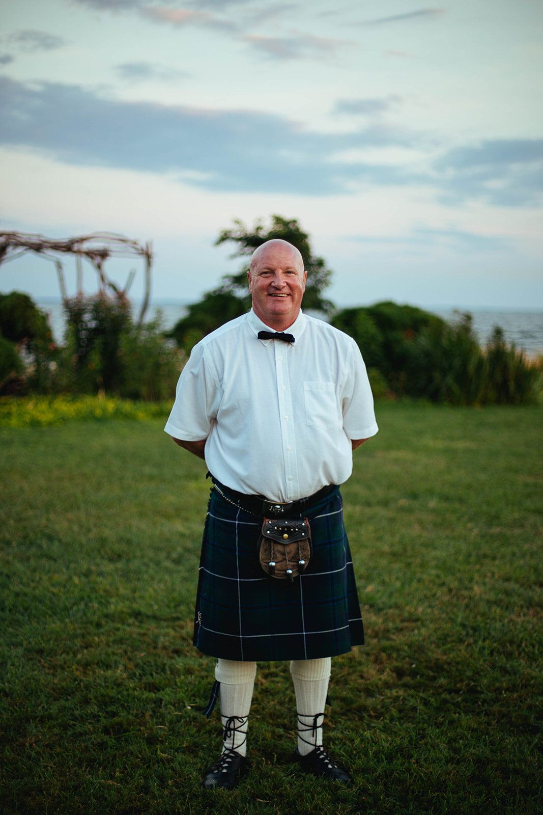 Wedding guest wearing a kilt on Tilghman Island MD Shawnee Custalow photography