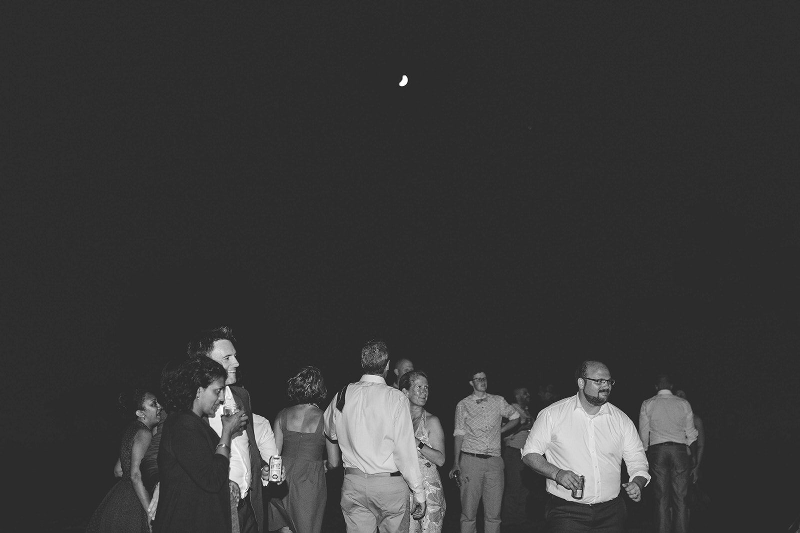 Wedding guests under a half moon on Tilghman Island MD Shawnee Custalow photography