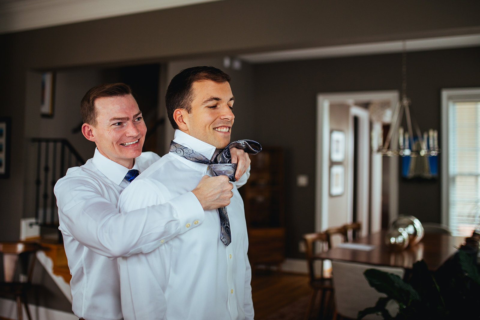 Future spouse helping partner tie his tie in Richmond VA Shawnee Custalow photography