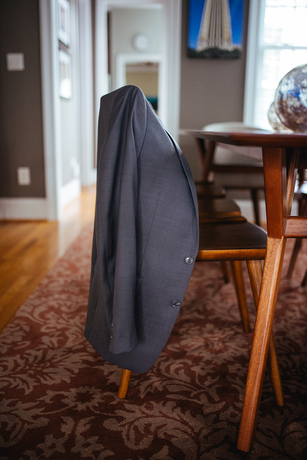 Suit jacket hanging in Richmond VA Shawnee Custalow queer wedding photographer