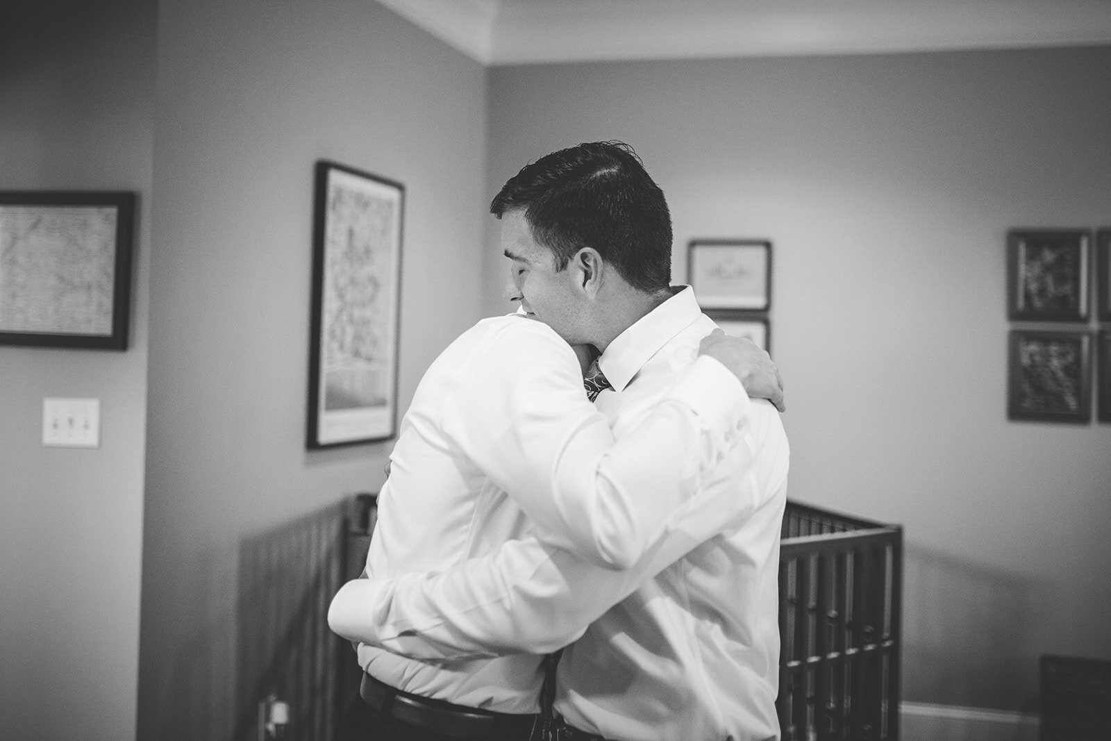 LGBTQ grooms hugging in Richmond VA home Shawnee Custalow queer wedding photographer