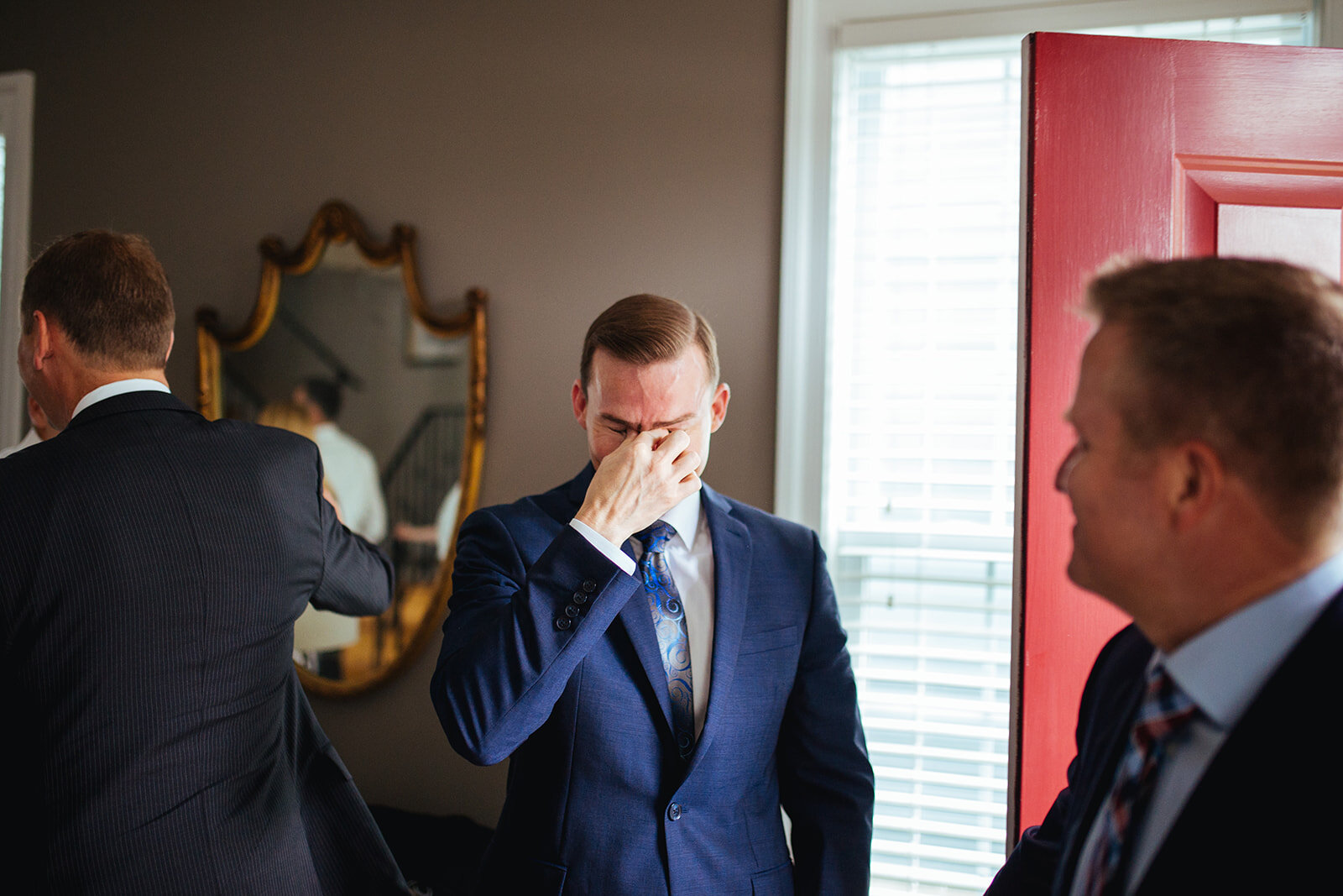 Emotional groom at Richmond VA home Shawnee Custalow queer wedding photographer