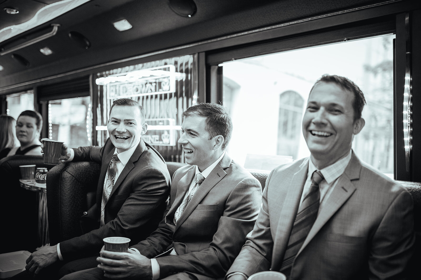 LGBTQ grooms and wedding party on a party bus in RVA Shawnee Custalow photography