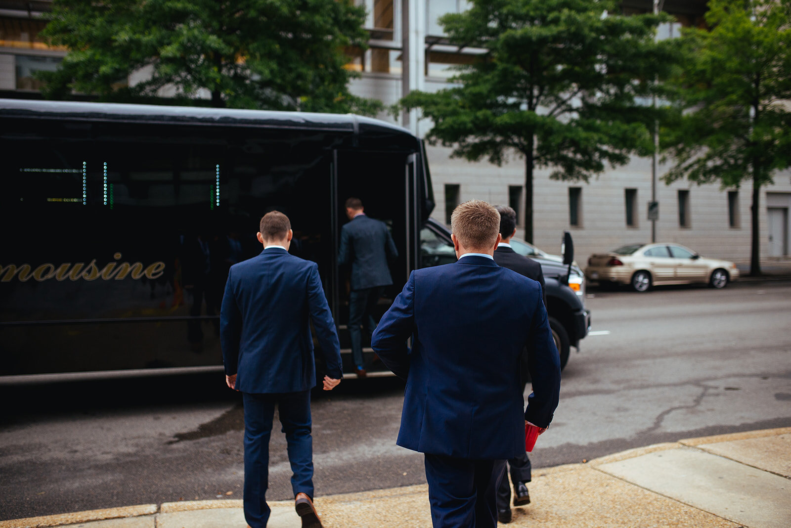 Wedding party getting on a party bus in Richmond VA Shawnee Custalow photography