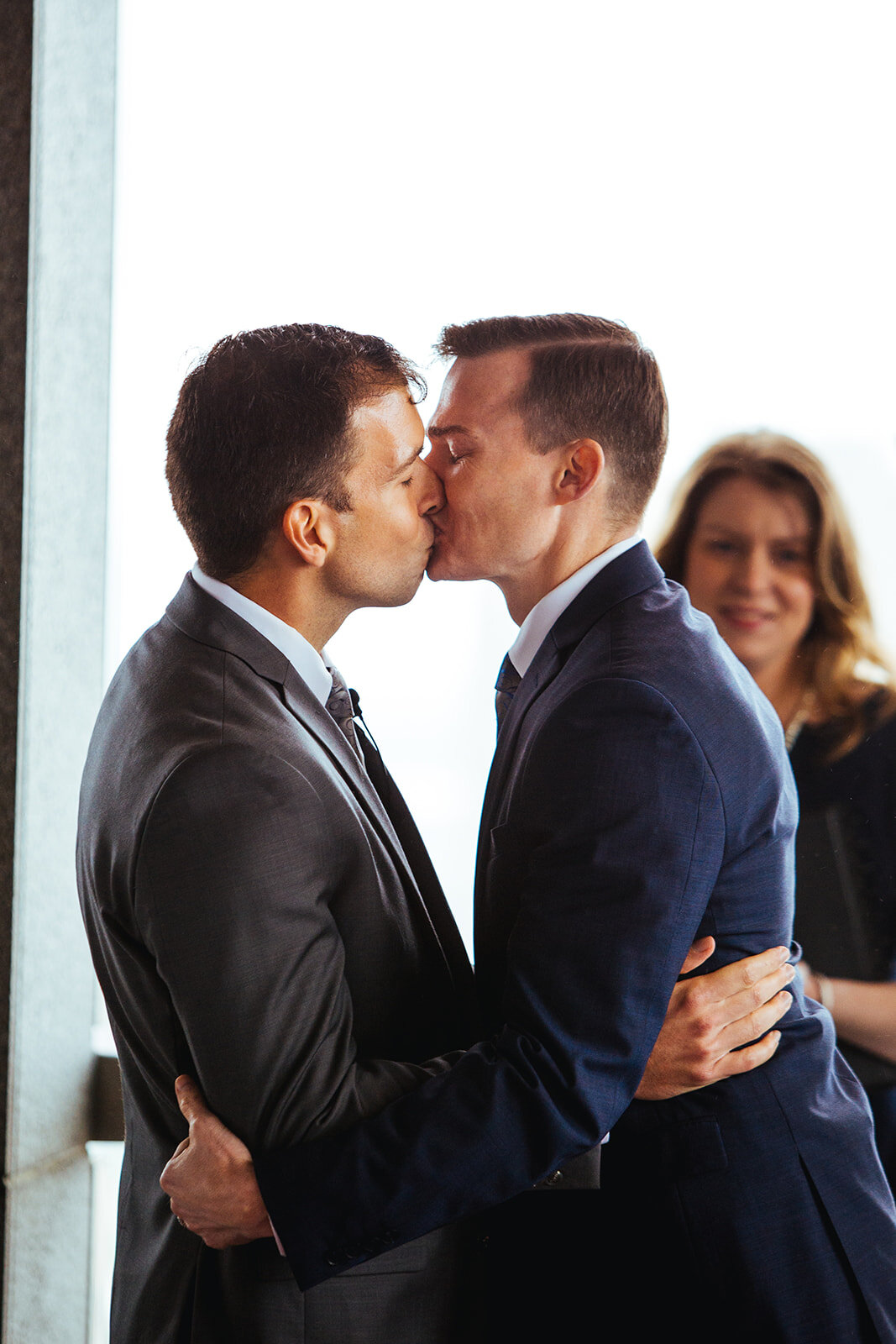 LGBTQ newlyweds kissing at RVA City Hall Shawnee Custalow wedding photography