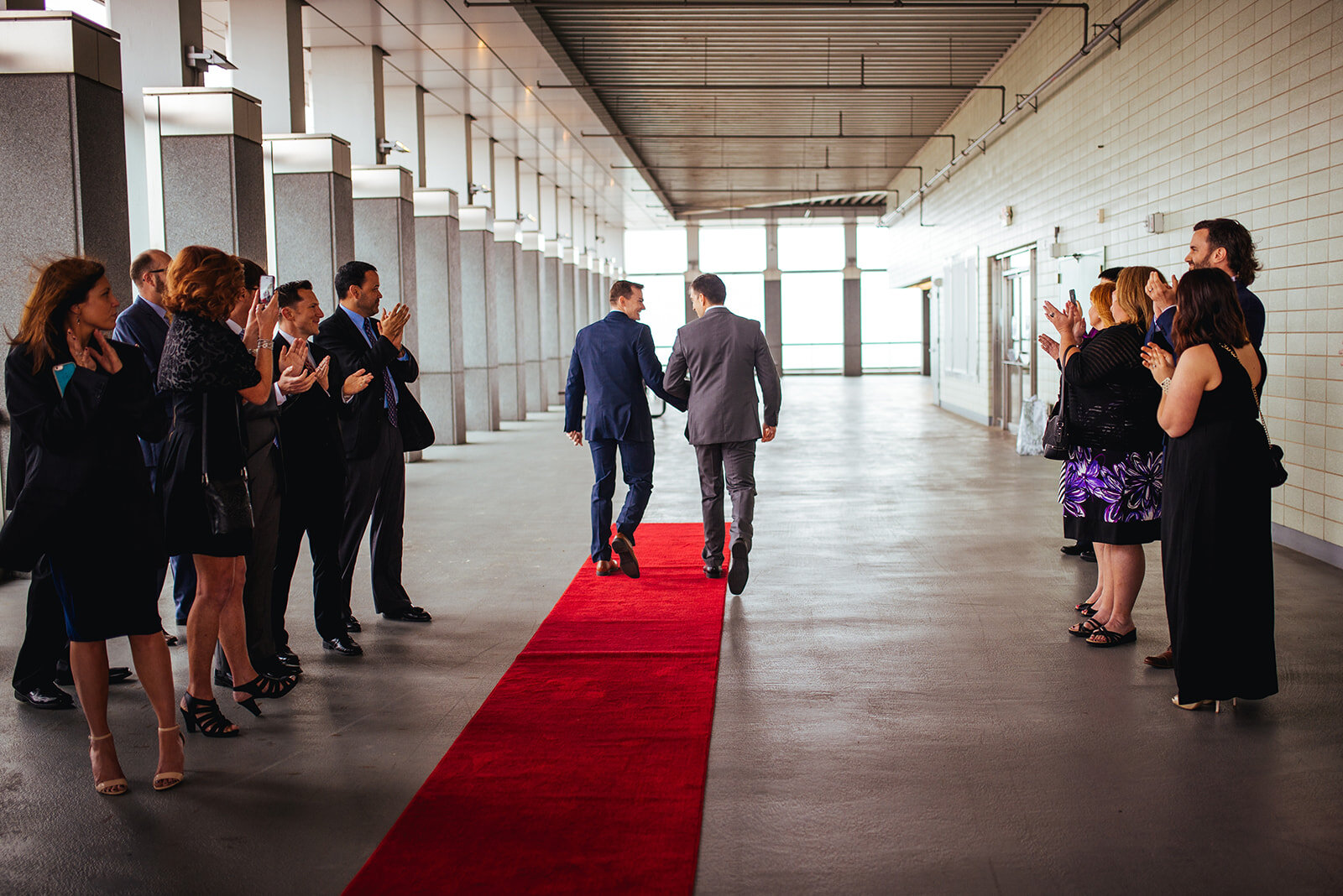 LGBTQ newlyweds walking back down the aisle at RVA City Hall Shawnee Custalow photography