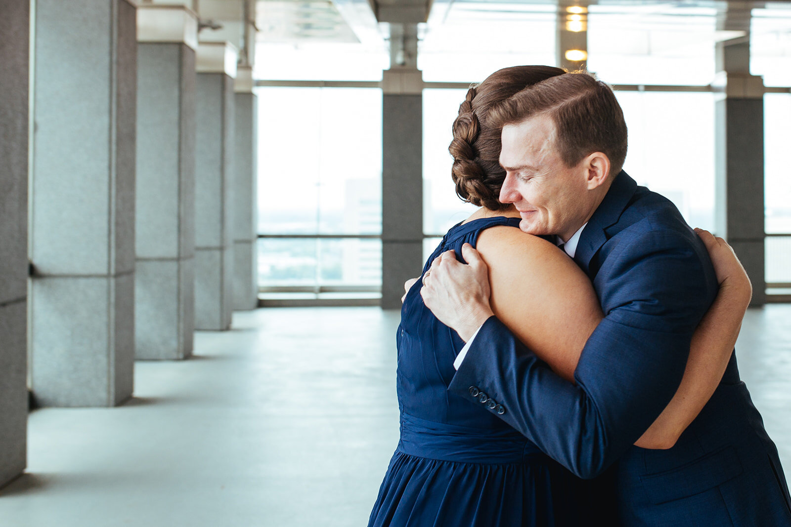 Newlywed hugging guest at Richmond VA City Hall Shawnee Custalow wedding photography