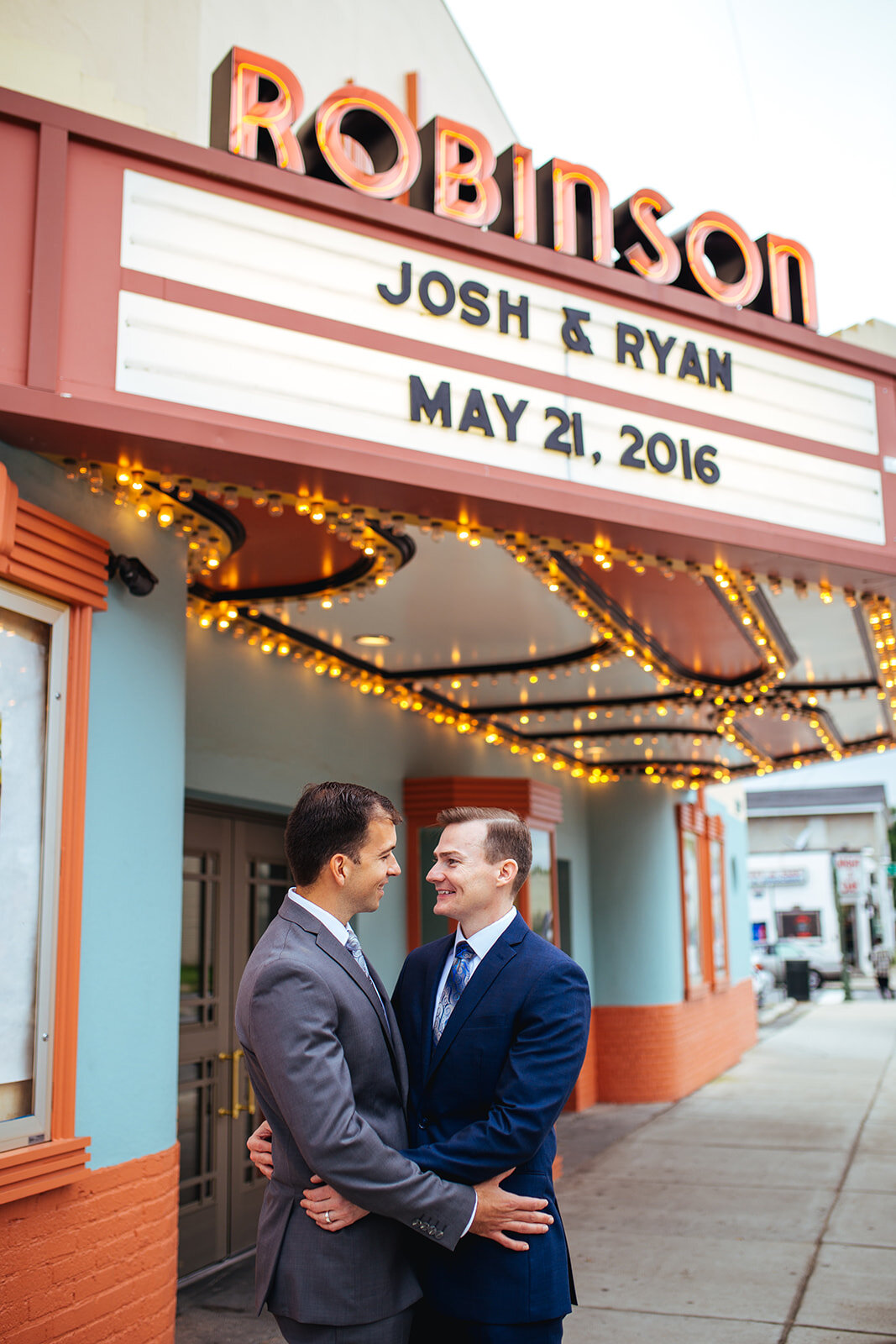 Happy newlyweds embracing outside Robinson Theather RVA Shawnee Custalow photography