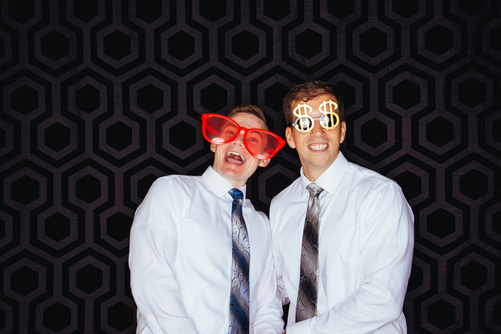Newlyweds with props in a photobooth at Robinson Theater RVA Shawnee Custalow photography