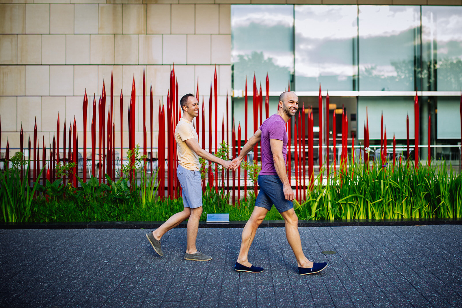 Queer couple walking hand in hand outside the VMFA Richmond Shawnee Custalow photographer