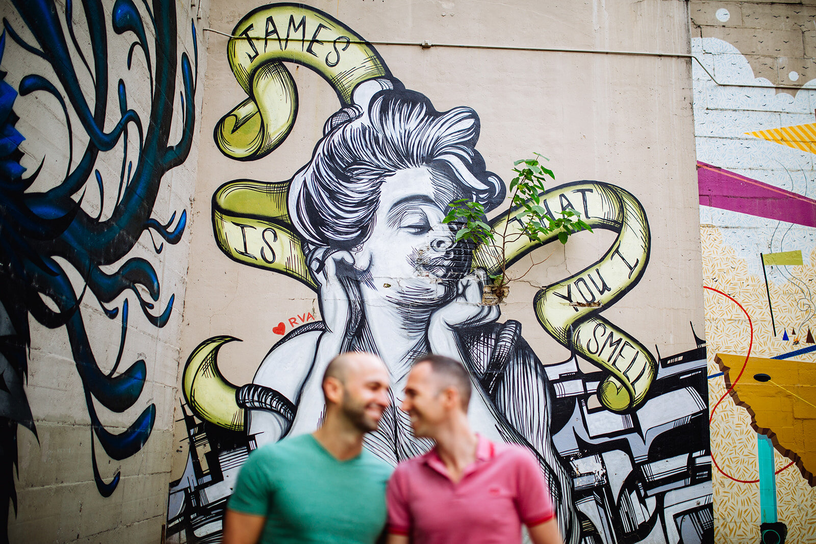 LGBTQ Couple under a mural in Richmond VA Shawnee Custalow photography
